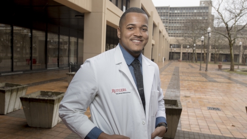 Medical school student with a white coat in Newark