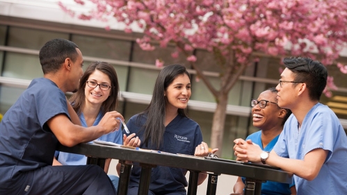 Dental students in a courtyard