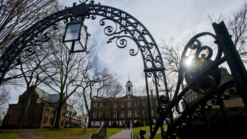 The sun shines through Old Queens Arch on Rutgers' campus