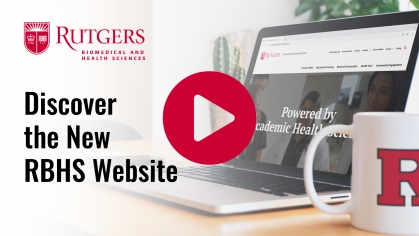 A video title card showing the words "Discover the New RBHS Website" layered over an image of an open laptop with a coffee cup nearby