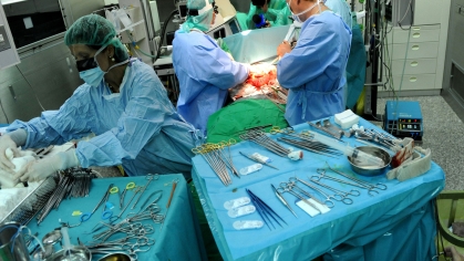 surgeons perform liver transplant