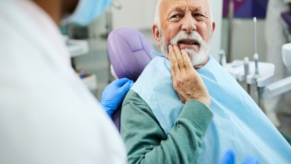 dental patient shows pain
