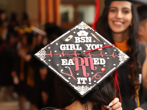 A nursing school BSN graduate's cap says girl, you eaRNed it!