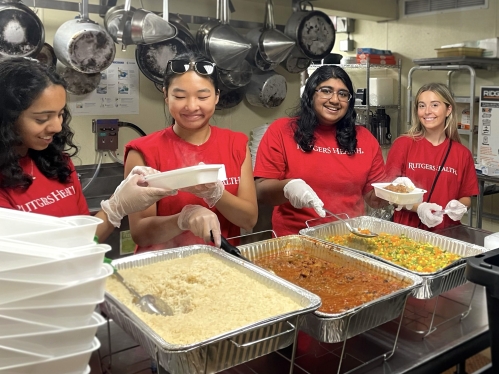 High school students participate in a service-learning program at a soup kitchen