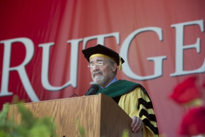Chancellor Brian Strom speaks at a podium at commencement 
